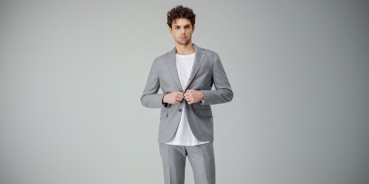 Men's sale: man in a light grey suit over a white T-shirt